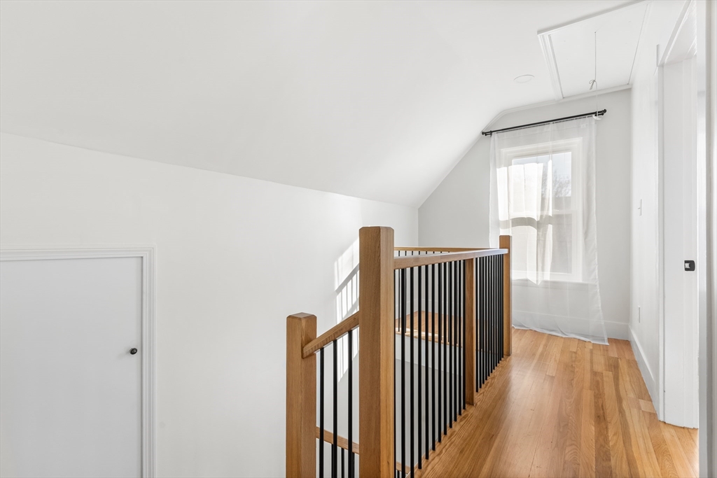 12 Viden Road Quincy, MA 02169 - Photo 4 of 29 a view of a room with wooden floor and stairs