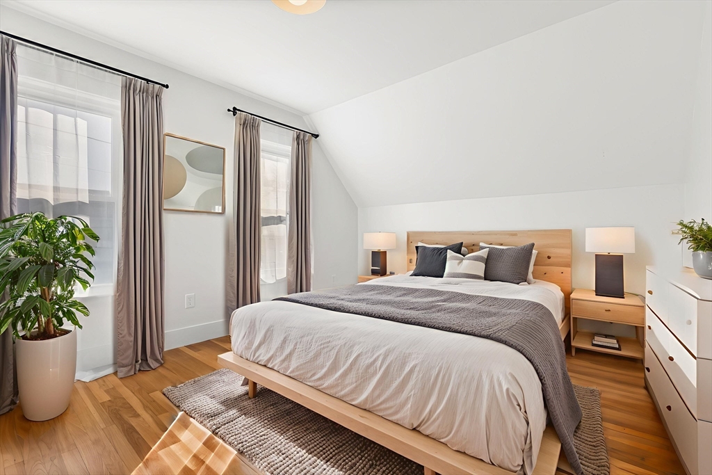 12 Viden Road Quincy, MA 02169 - Photo 5 of 29 a bedroom with a large bed and a potted plant