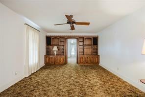 1717 Pipeline Road Cleburne, TX 76033 - Photo 16 of 33 Unfurnished living room with carpet floors, ceiling fan, and healthy amount of natural light