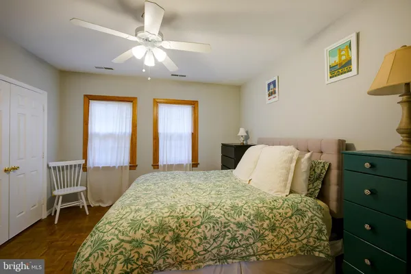 a bedroom with a bed and a table