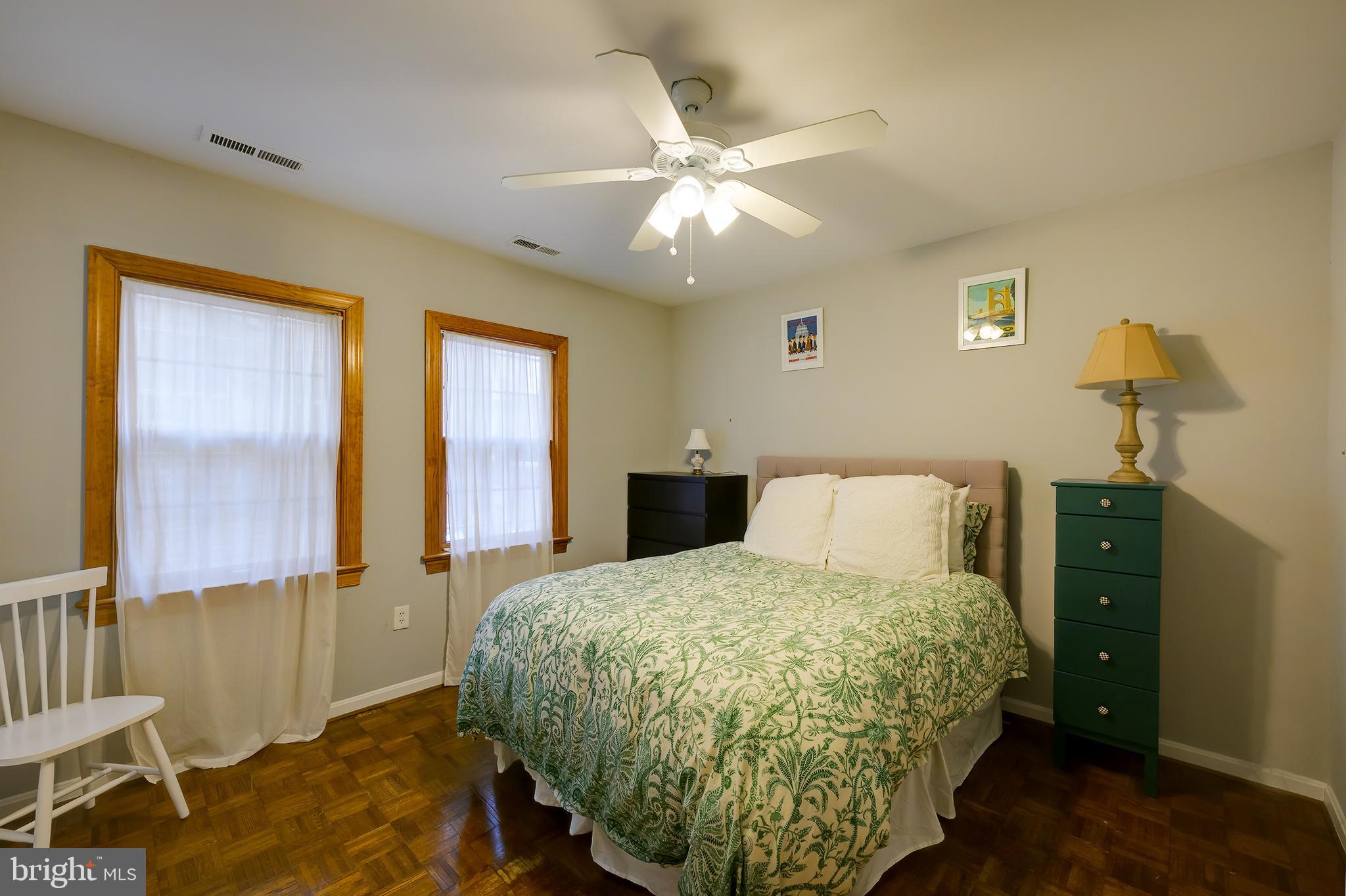 226 3rd Street Northeast, Unit 35 Washington, DC 20002 - Photo 17 of 19 a bed room with a bed and a chandelier