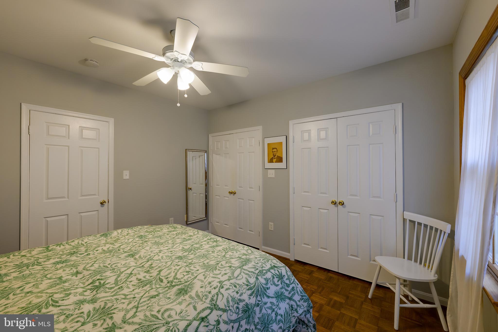 226 3rd Street Northeast, Unit 35 Washington, DC 20002 - Photo 18 of 19 a bedroom with a bed and a chandelier