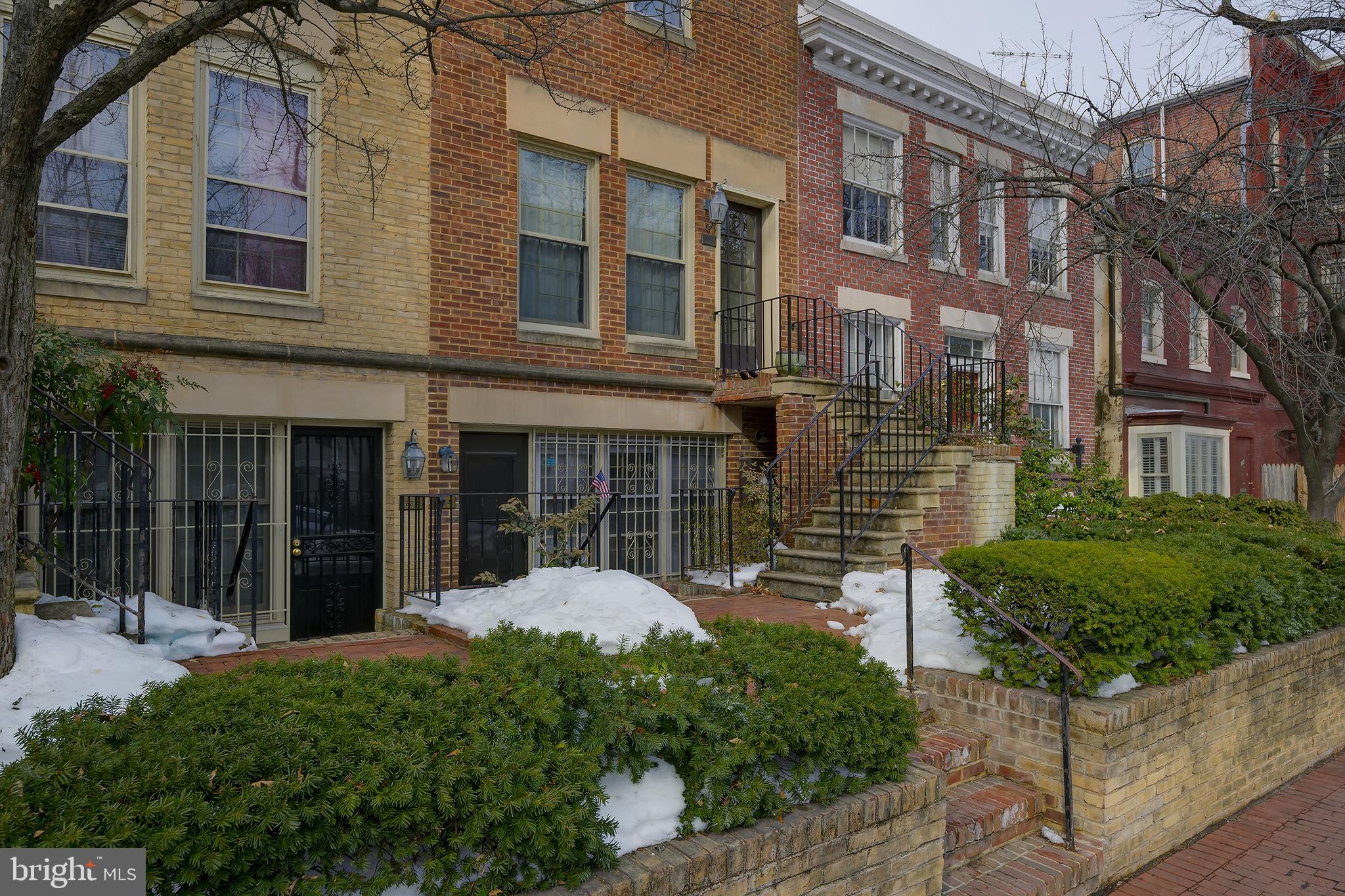 226 3rd Street Northeast, Unit 35 Washington, DC 20002 - Photo 2 of 19 a view of a brick building next to a yard