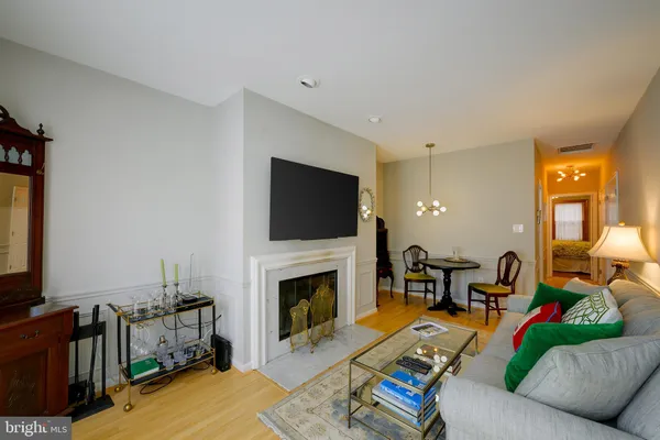 a living room with furniture fireplace and a flat screen tv