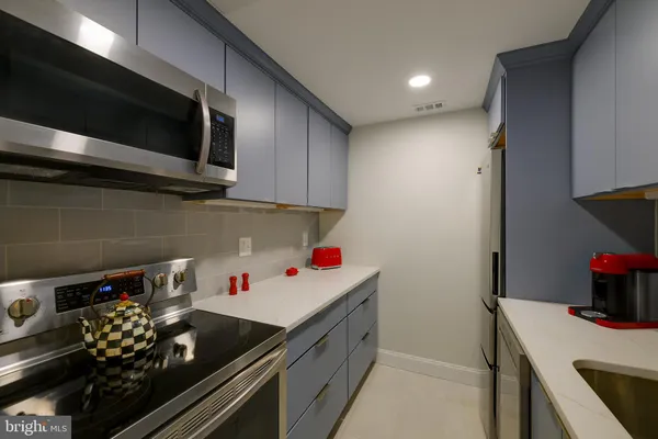 a kitchen with a stove and a microwave