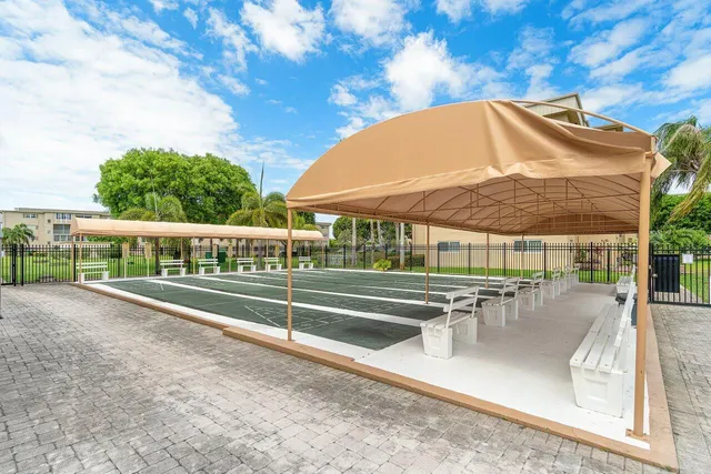 swimming pool view with a seating space