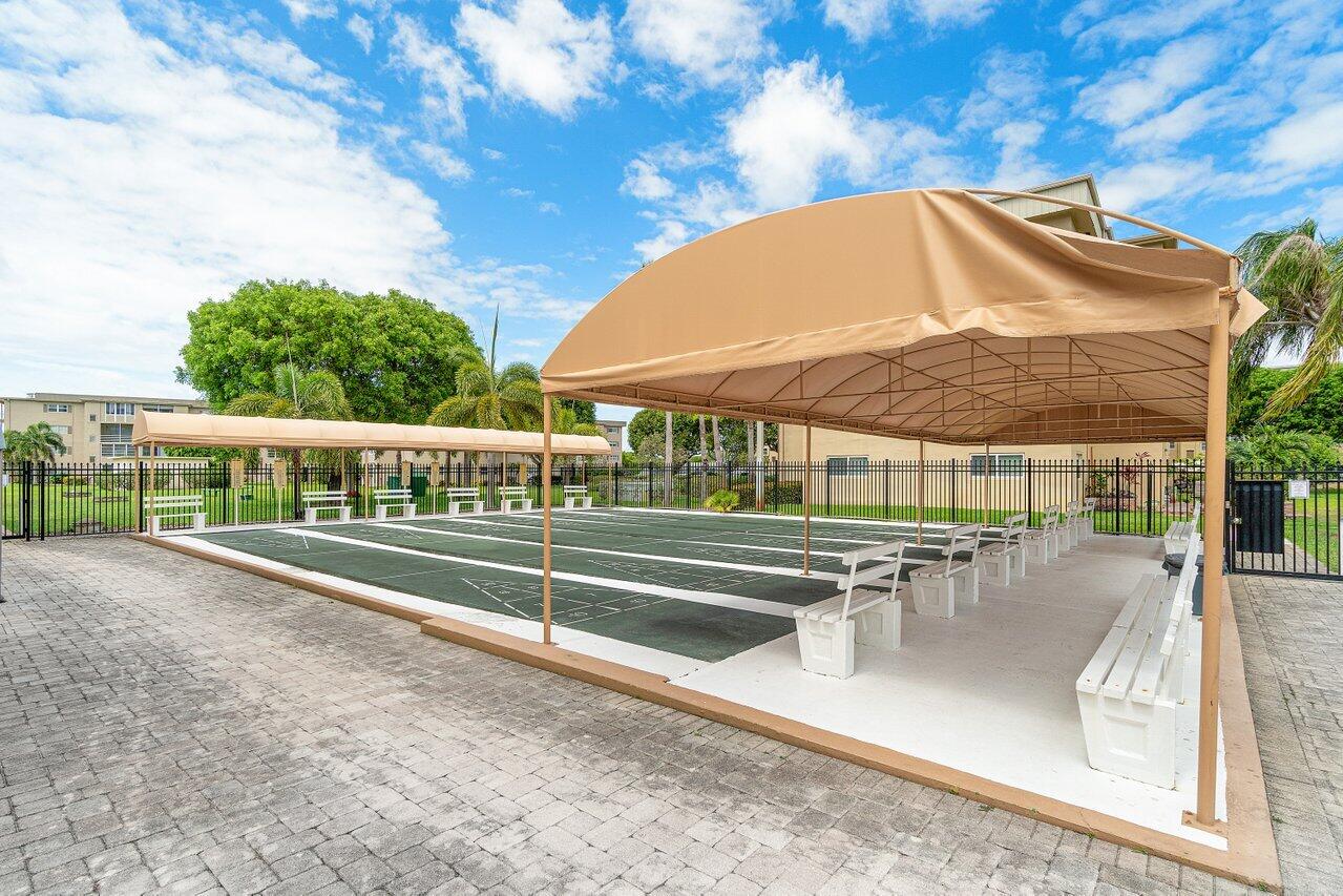 2615 Northeast 3rd Street, Unit 308 Boynton Beach, FL 33435 - Photo 24 of 27 swimming pool view with a seating space