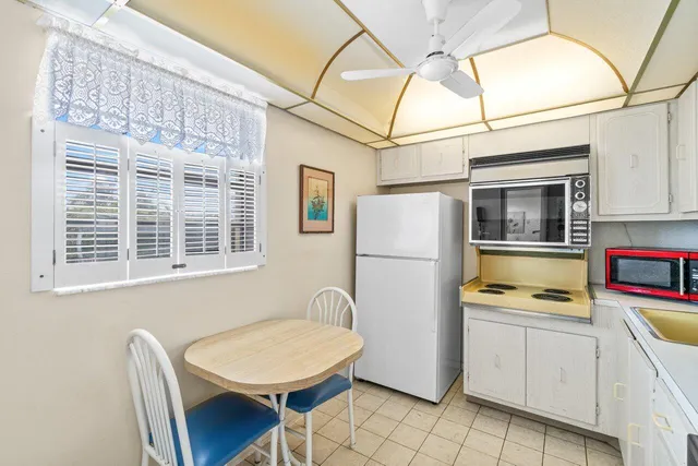 a kitchen with stainless steel appliances a refrigerator and a stove