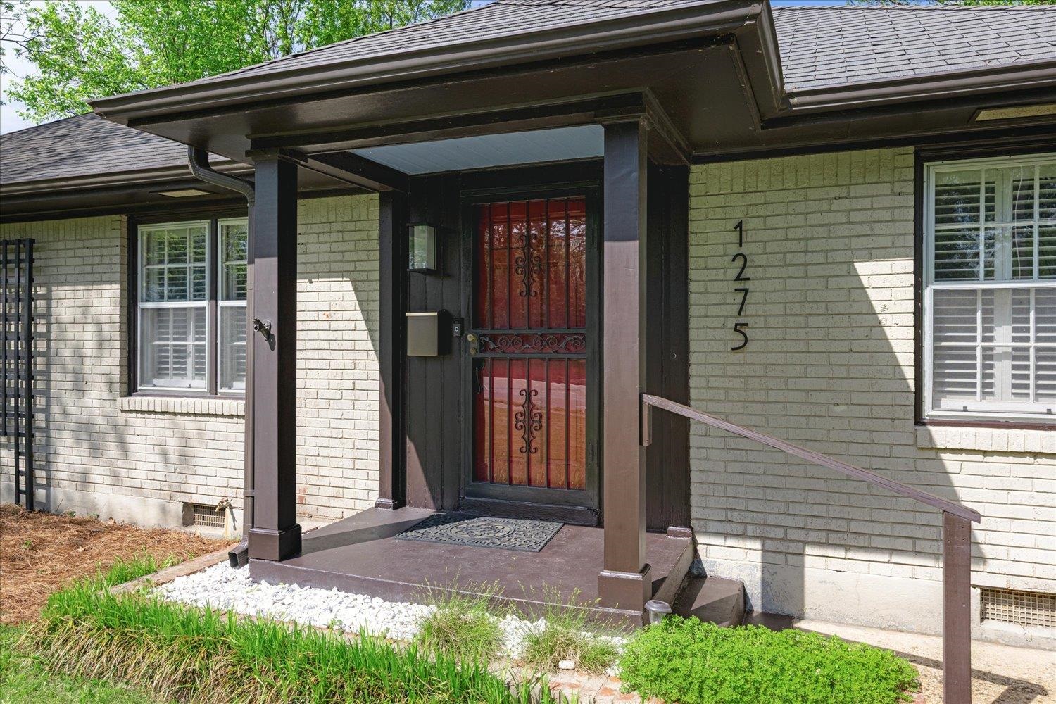 1275 Colonial Road Memphis, TN 38117 - Photo 3 of 24 Doorway to property featuring brick siding
