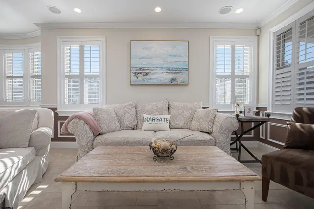 a living room with furniture and windows