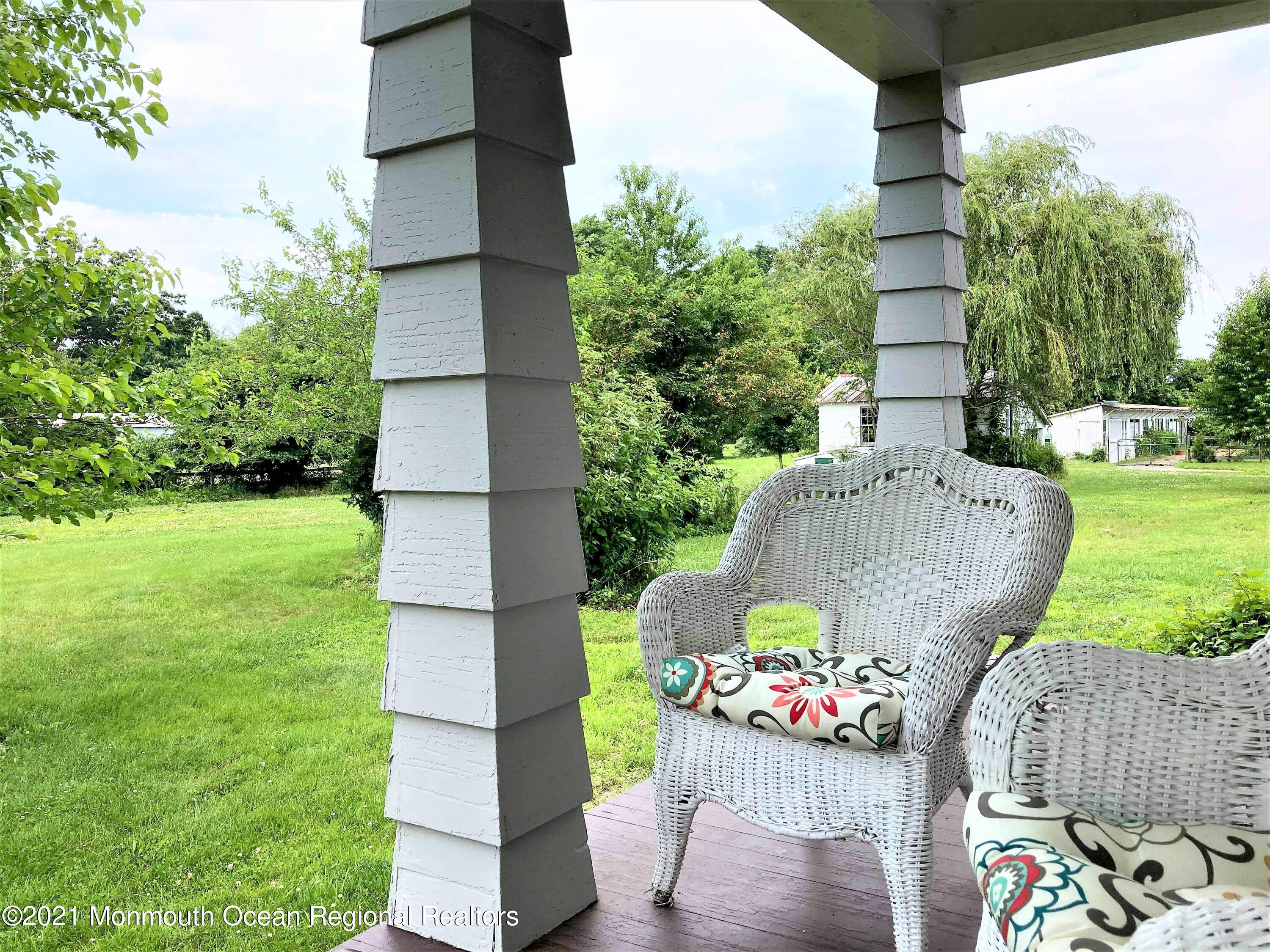 16 Province Line Road New Egypt, NJ 08533 - Photo 16 of 19 a front view of house with outdoor seating and green space