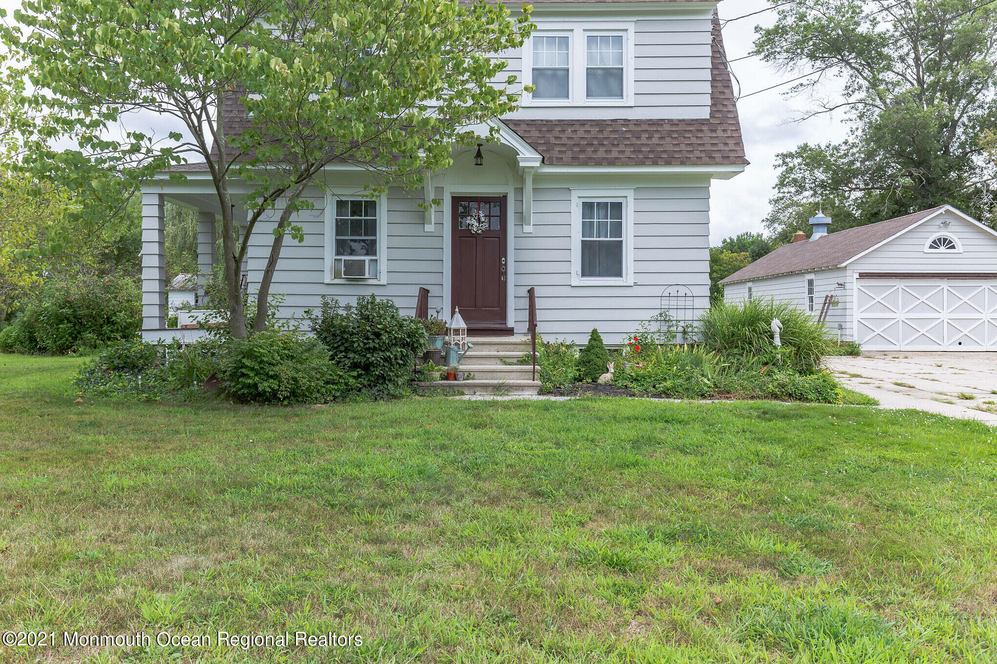 16 Province Line Road New Egypt, NJ 08533 - Photo 3 of 19 a front view of a house with a yard and garage