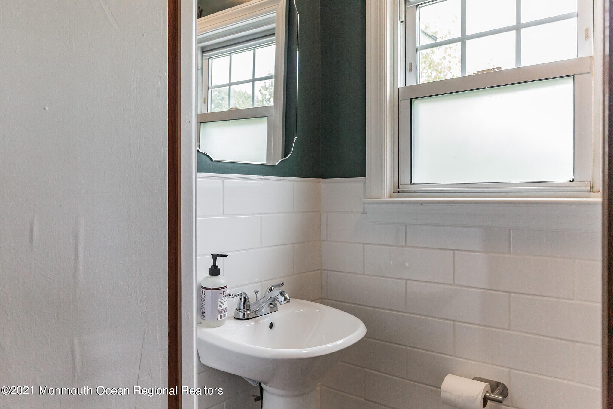 16 Province Line Road New Egypt, NJ 08533 - Photo 8 of 19 a bathroom with a sink a mirror and a window