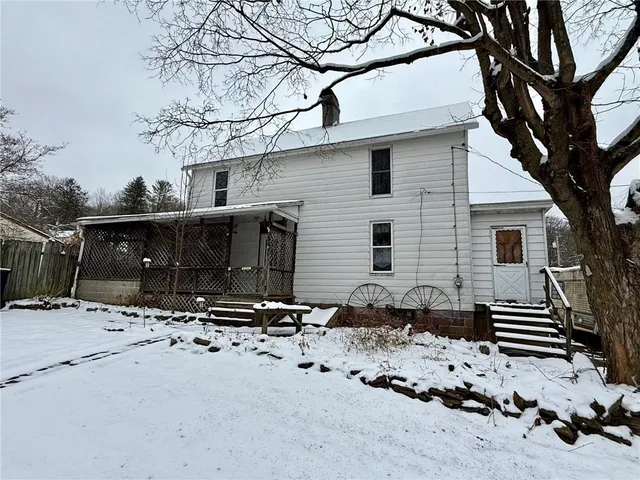 a front view of a house with yard