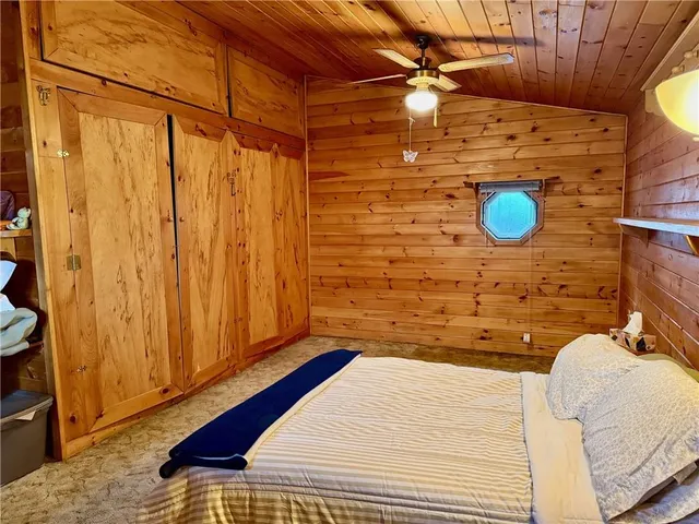 a bedroom with a bed and a cabinets