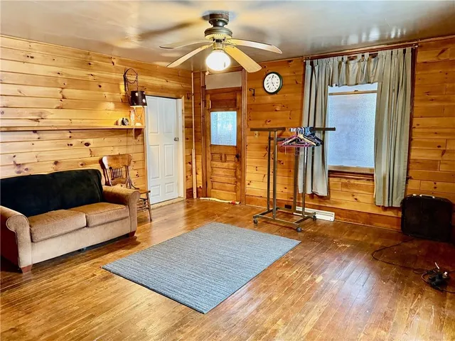 a bedroom with double bed and a couch