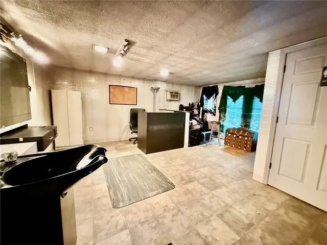 a bedroom with a bed and a large mirror