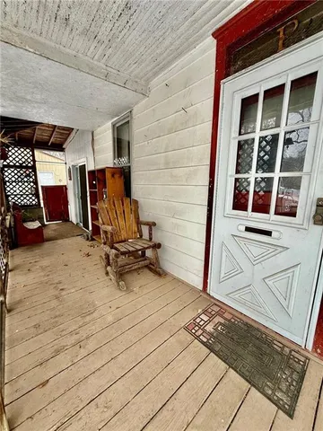 a view of a chairs with wooden floor