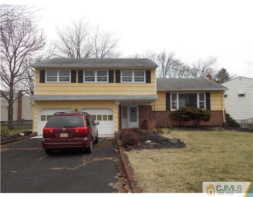 4 Wren Court Edison, NJ 08820 - Photo 1 of 16 a house view with a garden space