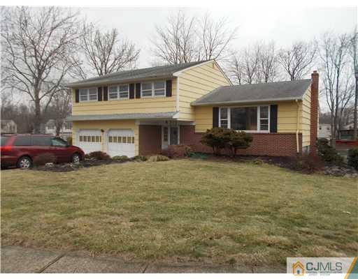 4 Wren Court Edison, NJ 08820 - Photo 2 of 16 a front view of a house with garden