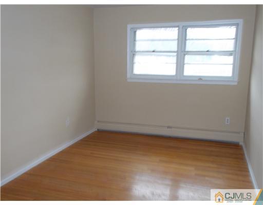 4 Wren Court Edison, NJ 08820 - Photo 11 of 16 an empty room with a window