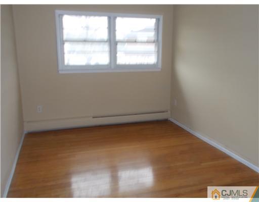 4 Wren Court Edison, NJ 08820 - Photo 13 of 16 an empty room with a window