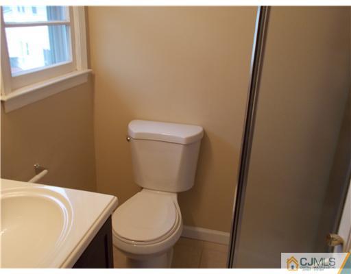 4 Wren Court Edison, NJ 08820 - Photo 16 of 16 a bathroom with a toilet and a sink