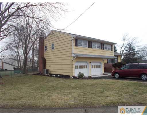 4 Wren Court Edison, NJ 08820 - Photo 3 of 16 a front view of a house with garden