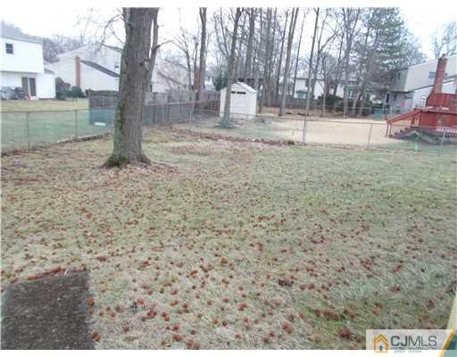 4 Wren Court Edison, NJ 08820 - Photo 4 of 16 a view of a outdoor space with trees