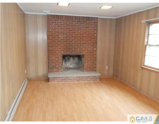 4 Wren Court Edison, NJ 08820 - Photo 5 of 16 a view of empty room with a fireplace
