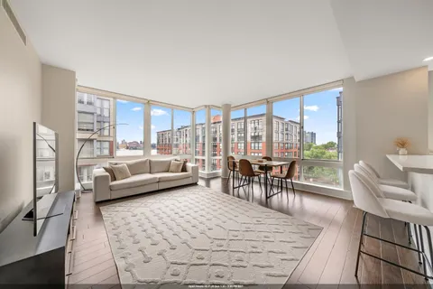a living room with furniture and a table