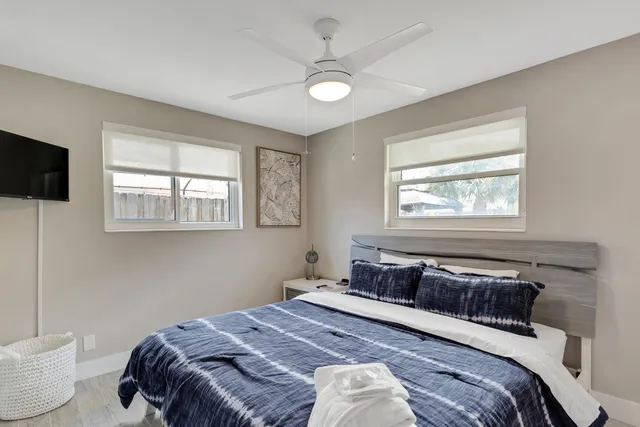 a bedroom with a large bed and a window