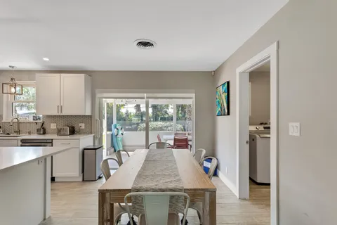 a kitchen with a sink stove and refrigerator