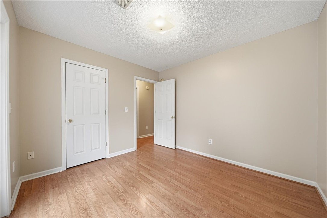 101 Grand Oak Circle Pendleton, SC 29670 - Photo 22 of 40 A well-lit bedroom features warm hardwood flooring, ready for your personal touch.