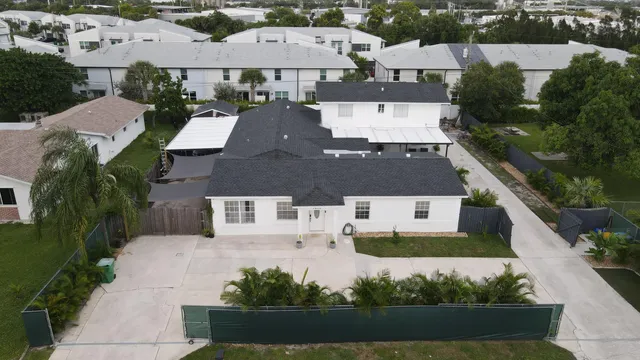 an aerial view of a house with a garden