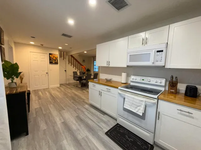 a bedroom with a bed and a television