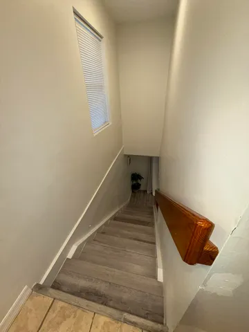 a kitchen with stainless steel appliances kitchen island granite countertop a stove a sink and a microwave