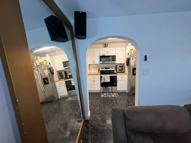 a view of a house with a backyard