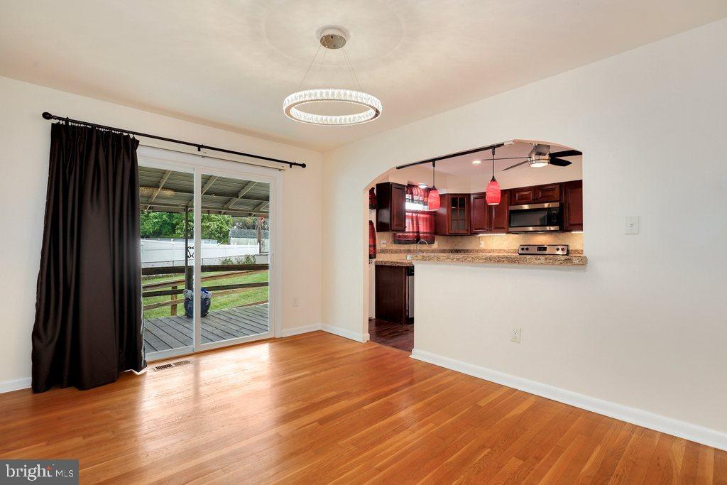 8538 Brest Road Randallstown, MD 21133 - Photo 11 of 47 a room with window and wooden floor