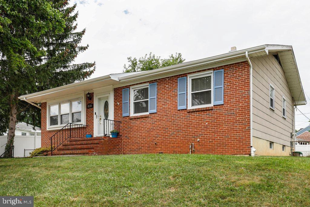 8538 Brest Road Randallstown, MD 21133 - Photo 2 of 47 a front view of a house with a garden