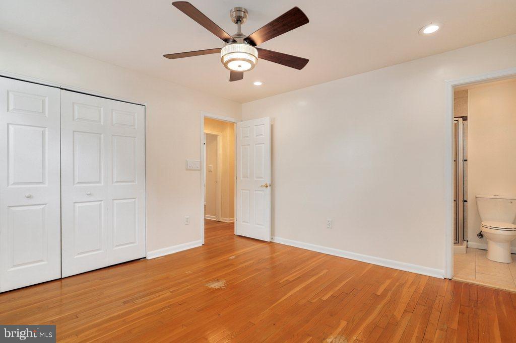 8538 Brest Road Randallstown, MD 21133 - Photo 25 of 47 wooden floor in an empty room with a window