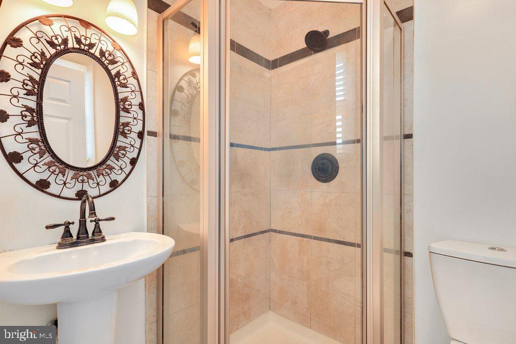 8538 Brest Road Randallstown, MD 21133 - Photo 26 of 47 a bathroom with a sink and a mirror
