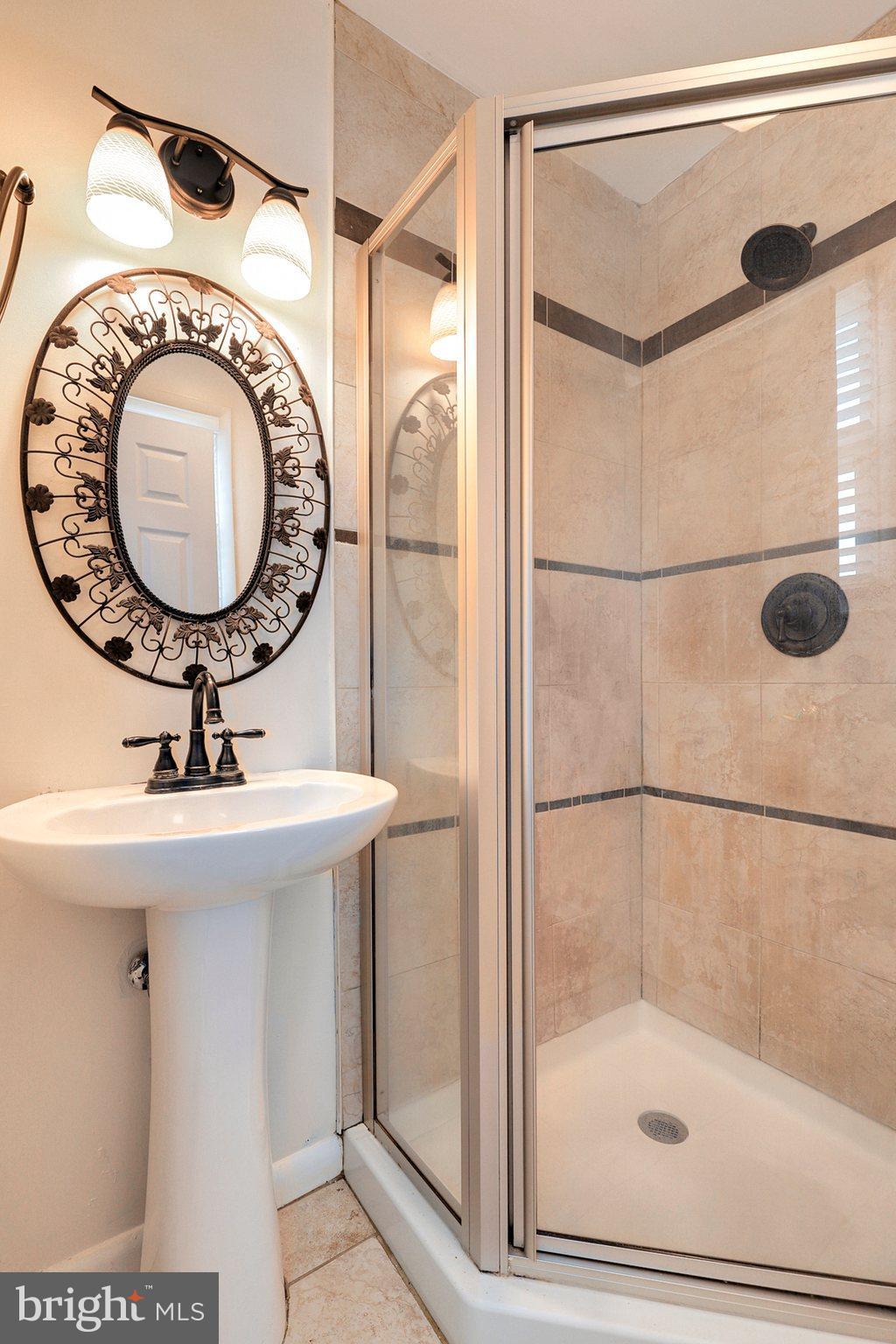 8538 Brest Road Randallstown, MD 21133 - Photo 27 of 47 a bathroom with a sink and shower