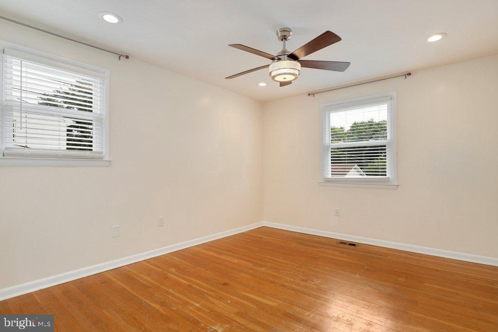 8538 Brest Road Randallstown, MD 21133 - Photo 28 of 47 a view of a big room with wooden floor and windows