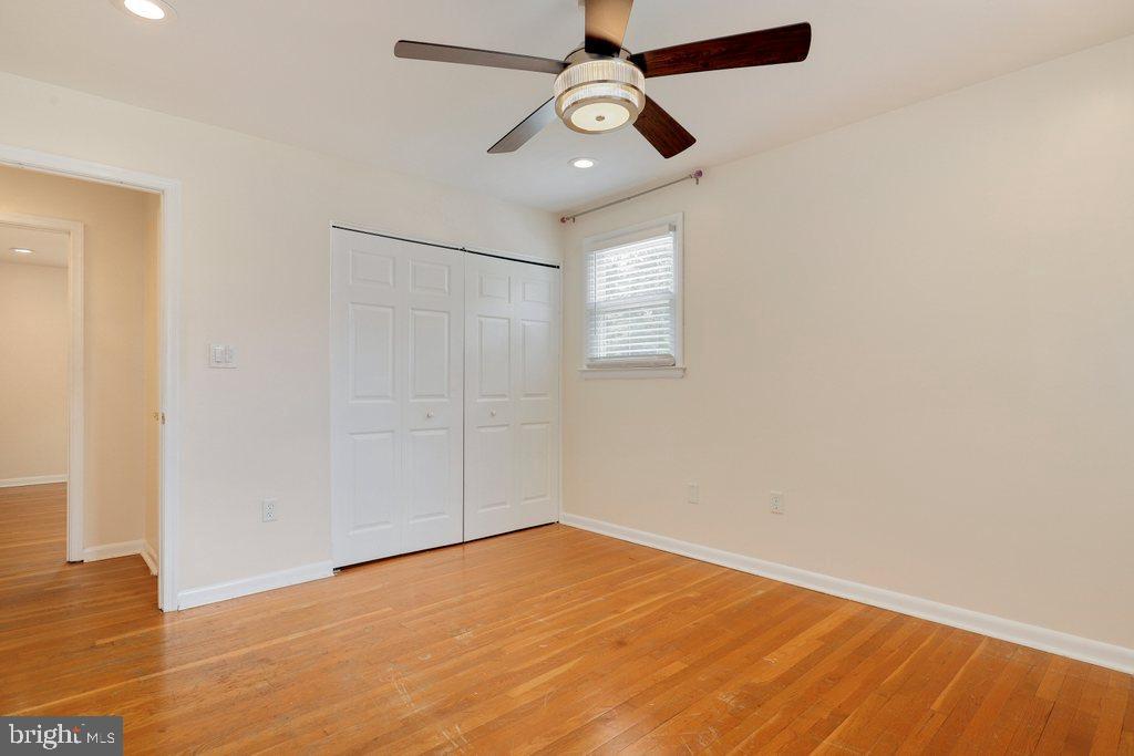 8538 Brest Road Randallstown, MD 21133 - Photo 30 of 47 an empty room with a window and ceiling fan
