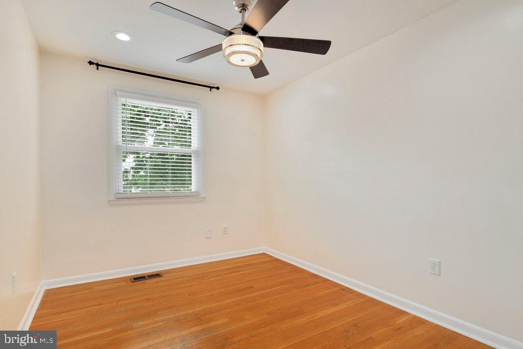 8538 Brest Road Randallstown, MD 21133 - Photo 31 of 47 an empty room with a window and ceiling fan