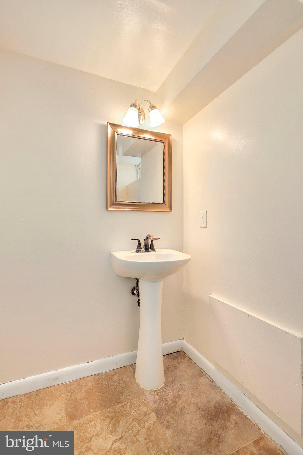8538 Brest Road Randallstown, MD 21133 - Photo 34 of 47 a bathroom with a sink