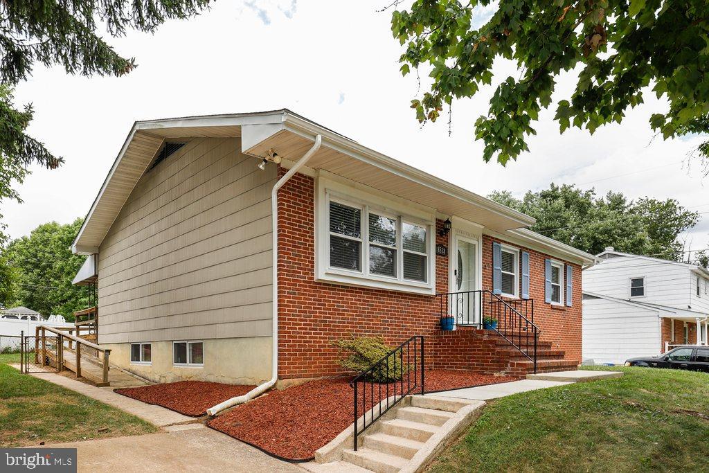 8538 Brest Road Randallstown, MD 21133 - Photo 4 of 47 a front view of a house with a yard
