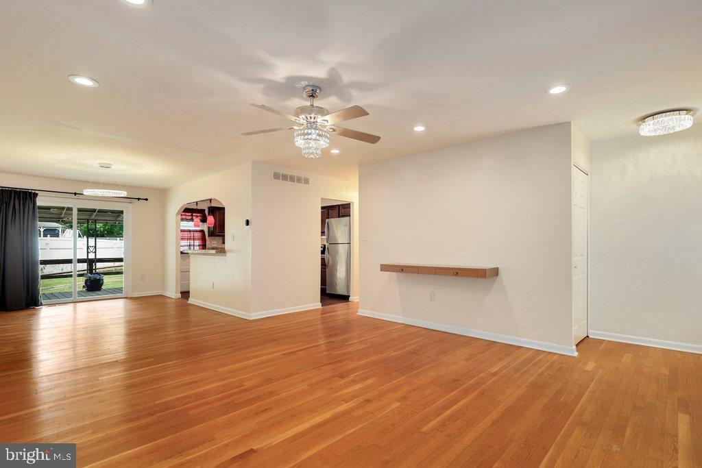 8538 Brest Road Randallstown, MD 21133 - Photo 7 of 47 a view of empty room with wooden floor