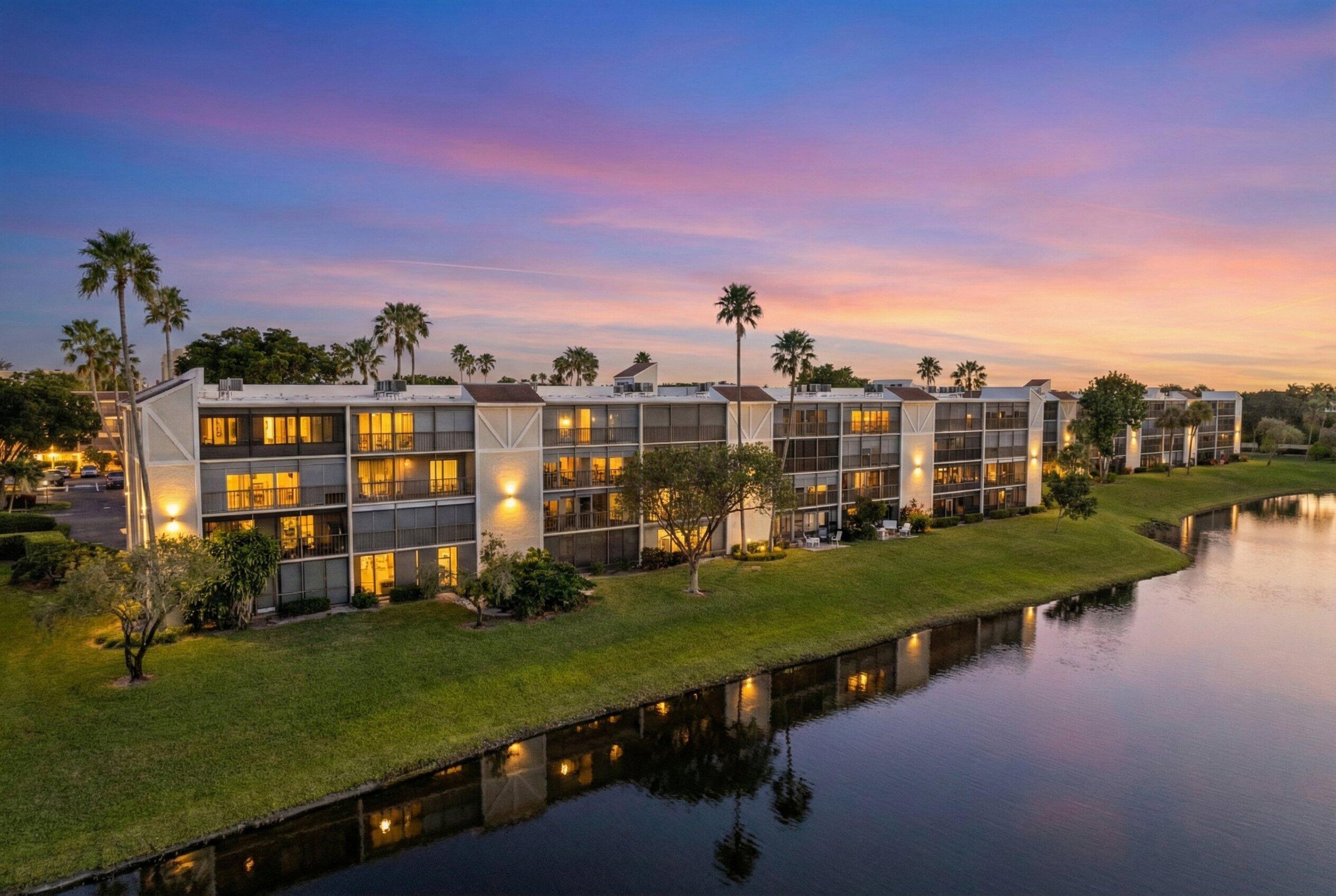 14360 Strathmore Lane, Unit 404 Delray Beach, FL 33446 - Photo 2 of 42 a view of a lake with a yard
